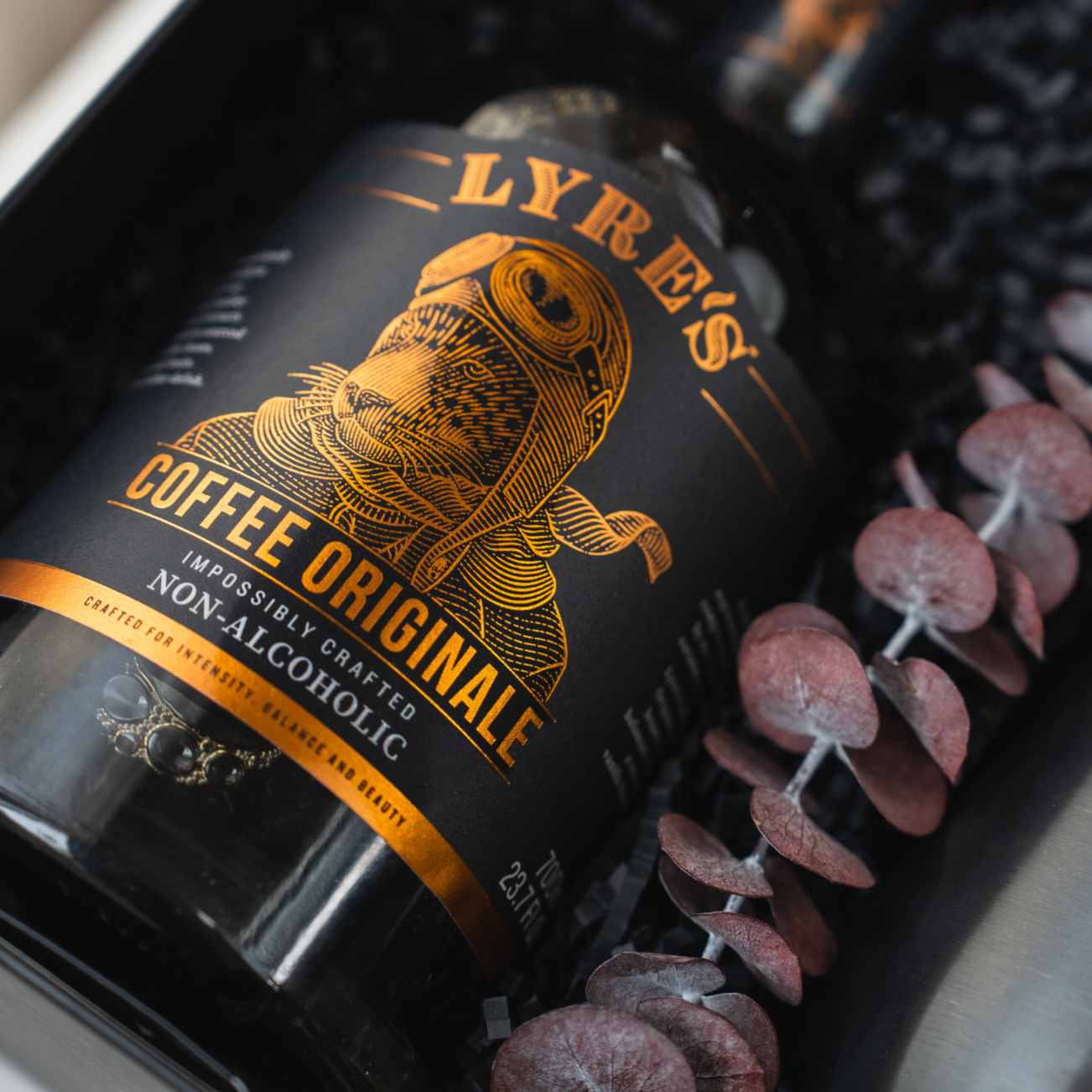 Lyres Coffee Original non-alcoholic drink bottle with decorative elements on a dark background